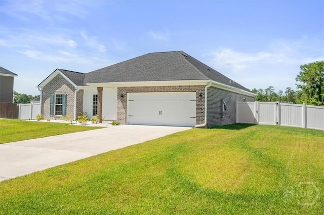 301 Akins Ranch Rd NE, Ludowici, GA 31316 - view of front of property with a gate, brick siding, an attached garage, and driveway