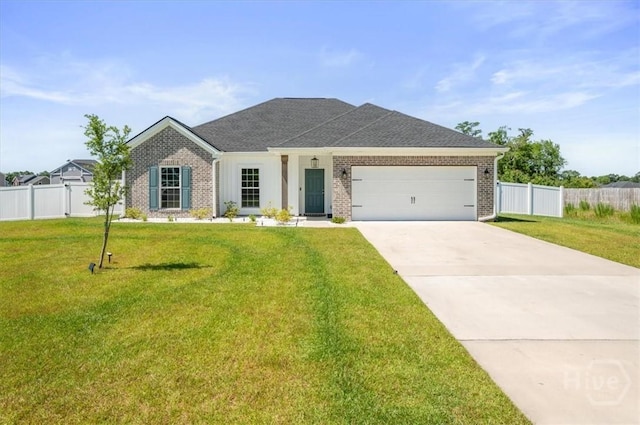 301 Akins Ranch Rd NE, Ludowici, GA 31316 - view of front of house with a garage, brick siding, driveway, and a shingled roof