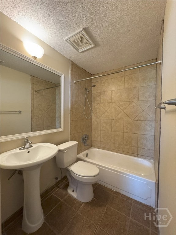 115 New Stillwell Rd, Springfield, GA 31329 - full bath with toilet, shower / bathtub combination, tile patterned flooring, a textured ceiling, and a sink