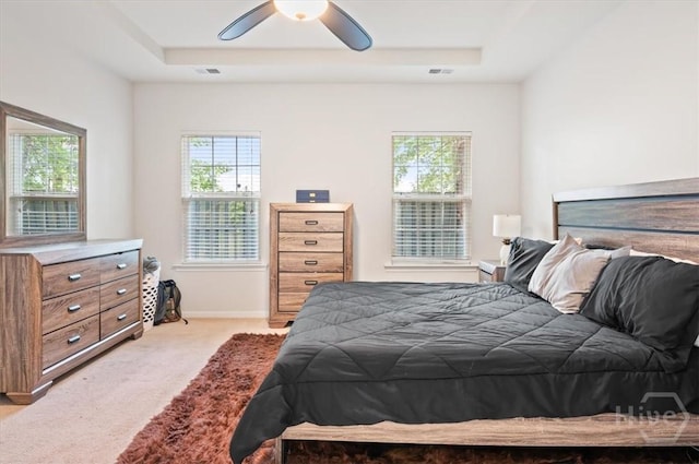 45 Glen Way, Richmond Hill, GA 31324 - bedroom featuring light colored carpet, a raised ceiling, a ceiling fan, and baseboards