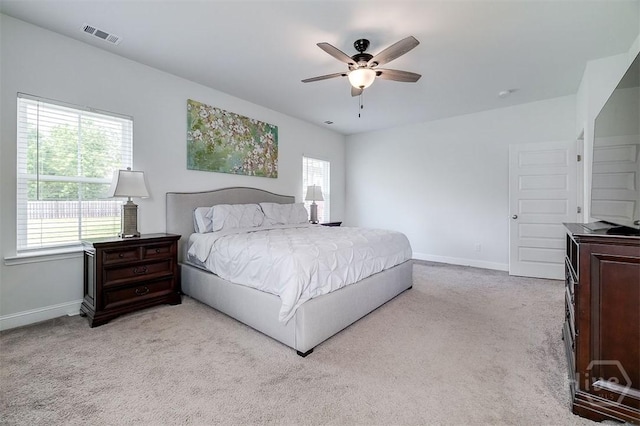 202 Thatcher St, Guyton, GA 31312 - carpeted bedroom with multiple windows, baseboards, and ceiling fan