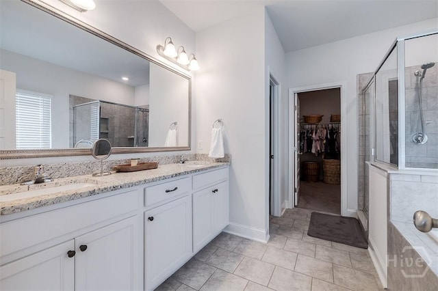 202 Thatcher St, Guyton, GA 31312 - bathroom with a shower stall, double vanity, a walk in closet, and a tub to relax in