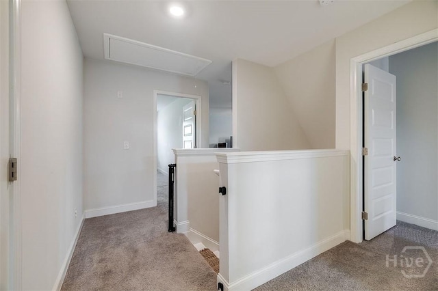 202 Thatcher St, Guyton, GA 31312 - hallway featuring attic access, carpet floors, an upstairs landing, and baseboards