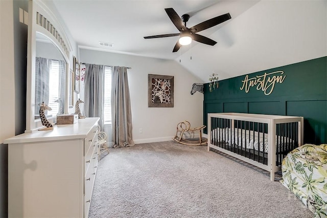 202 Thatcher St, Guyton, GA 31312 - bedroom featuring carpet flooring, vaulted ceiling, a ceiling fan, baseboards, and a nursery area