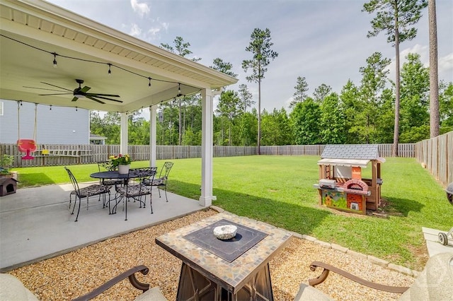 202 Thatcher St, Guyton, GA 31312 - view of patio / terrace featuring a fire pit and a ceiling fan
