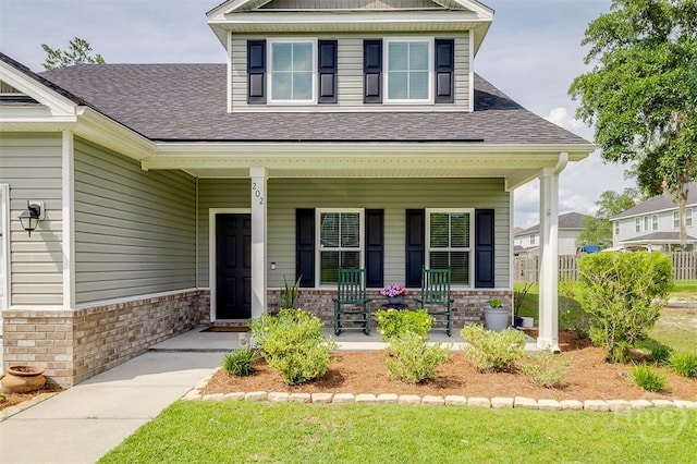 202 Thatcher St, Guyton, GA 31312 - craftsman-style home with covered porch and a shingled roof