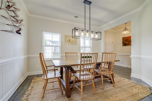 202 Thatcher St, Guyton, GA 31312 - dining room with wood finished floors, ornamental molding, a chandelier, and baseboards