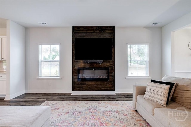 202 Thatcher St, Guyton, GA 31312 - living area featuring wood finished floors, healthy amount of natural light, and baseboards
