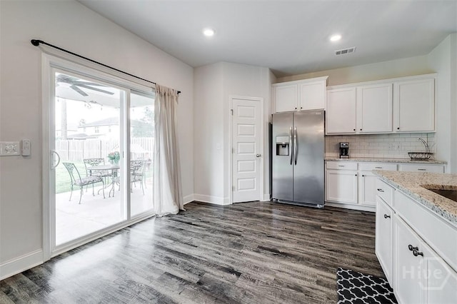 202 Thatcher St, Guyton, GA 31312 - kitchen with stainless steel refrigerator with ice dispenser, dark wood-style floors, white cabinets, and recessed lighting