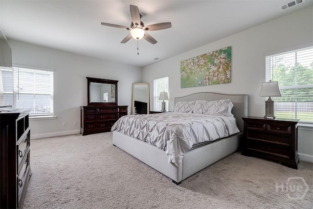 202 Thatcher St, Guyton, GA 31312 - bedroom featuring light colored carpet, baseboards, and ceiling fan