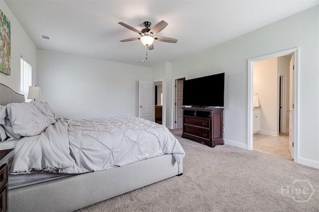 202 Thatcher St, Guyton, GA 31312 - carpeted bedroom featuring baseboards, a ceiling fan, and ensuite bath