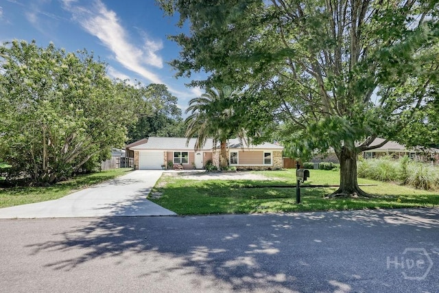 1522 Marcy Cir, Savannah, GA 31406 - view of front of house with concrete driveway, an attached garage, and stone siding