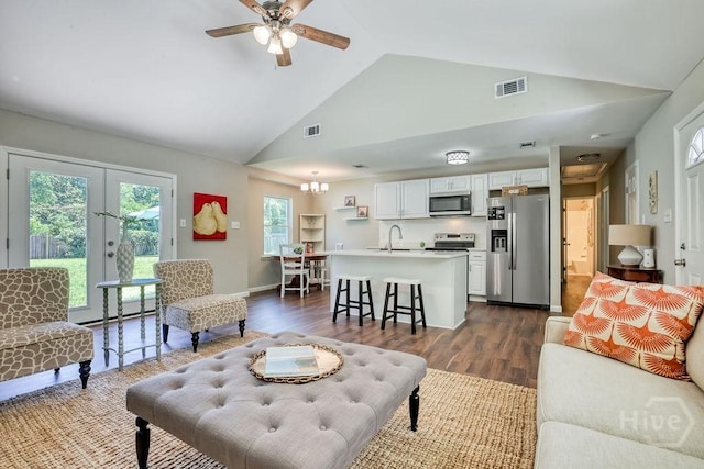 1522 Marcy Cir, Savannah, GA 31406 - living area with high vaulted ceiling, dark wood-type flooring, a ceiling fan, french doors, and baseboards