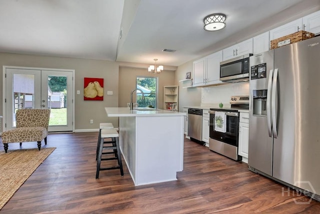 1522 Marcy Cir, Savannah, GA 31406 - kitchen with appliances with stainless steel finishes, a sink, white cabinetry, and dark wood-type flooring