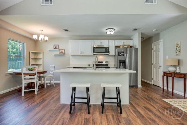1522 Marcy Cir, Savannah, GA 31406 - kitchen with stainless steel appliances, decorative backsplash, dark wood-style floors, and light countertops