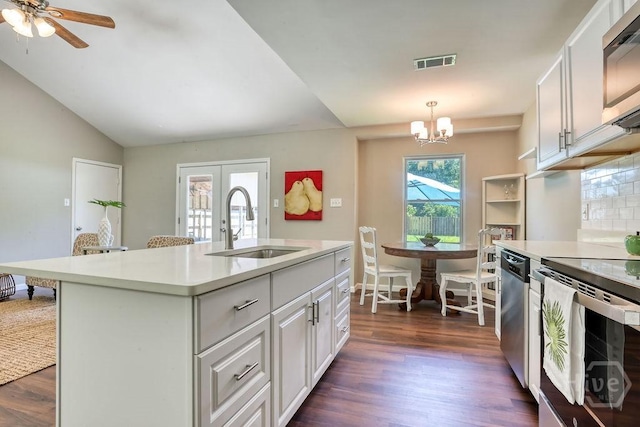 1522 Marcy Cir, Savannah, GA 31406 - kitchen featuring a sink, appliances with stainless steel finishes, light countertops, dark wood-style floors, and lofted ceiling
