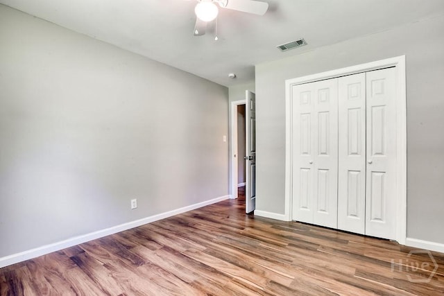 1522 Marcy Cir, Savannah, GA 31406 - unfurnished bedroom with wood finished floors, baseboards, a closet, and ceiling fan