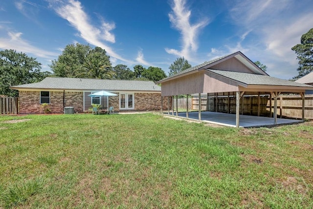1522 Marcy Cir, Savannah, GA 31406 - back of house with a detached carport and a patio area