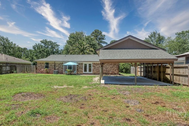 1522 Marcy Cir, Savannah, GA 31406 - back of house featuring a patio, french doors, central AC, and a carport