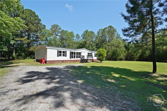 132 Waymaker Dr, Midway, GA 31320 - view of front facade featuring crawl space, a front yard, and gravel driveway