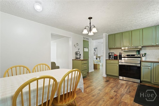 132 Waymaker Dr, Midway, GA 31320 - kitchen with green cabinetry, stainless steel range with electric cooktop, under cabinet range hood, dark wood-type flooring, and a textured ceiling