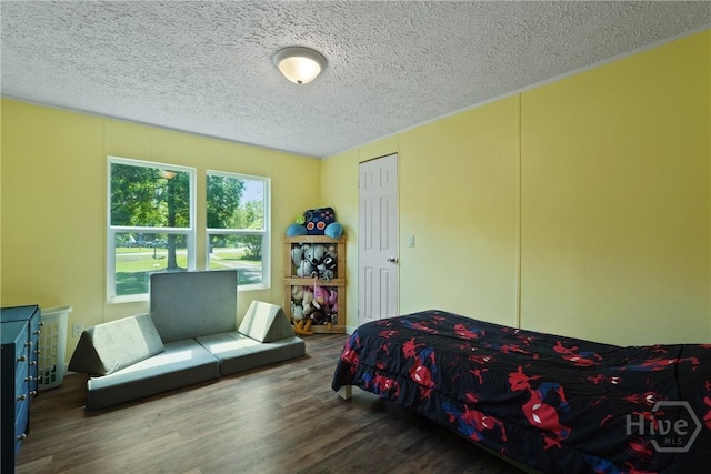 132 Waymaker Dr, Midway, GA 31320 - bedroom featuring wood finished floors and a textured ceiling
