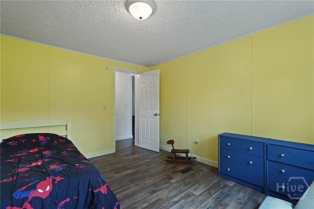 132 Waymaker Dr, Midway, GA 31320 - bedroom featuring wood finished floors, a textured ceiling, and baseboards