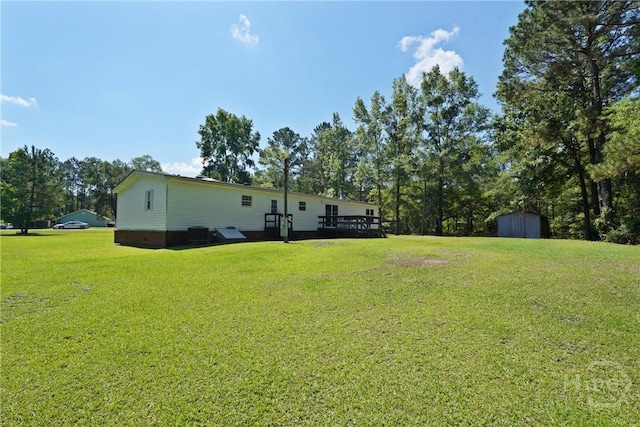 132 Waymaker Dr, Midway, GA 31320 - view of green lawn featuring a deck