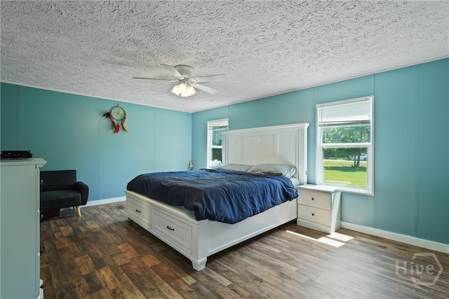 132 Waymaker Dr, Midway, GA 31320 - bedroom featuring wood finished floors, baseboards, a ceiling fan, and a textured ceiling