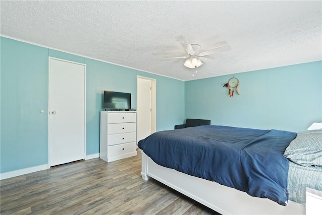 132 Waymaker Dr, Midway, GA 31320 - bedroom featuring wood finished floors, a textured ceiling, ceiling fan, and baseboards