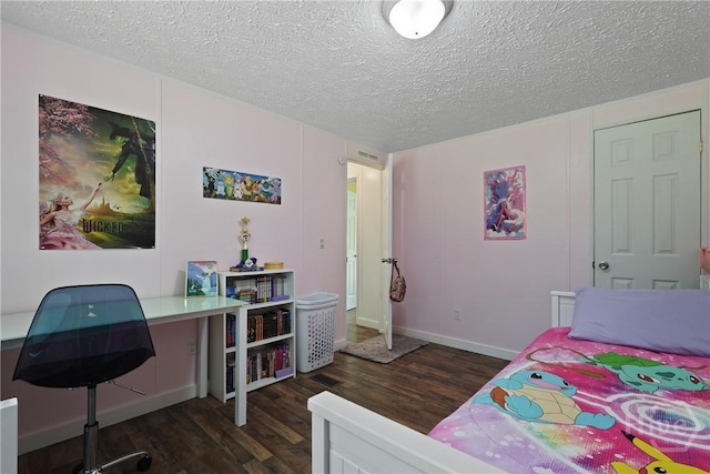 132 Waymaker Dr, Midway, GA 31320 - bedroom with dark wood-style floors, a textured ceiling, an office area, and baseboards