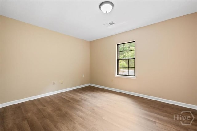 310 Ashmore St Unit A, B, Hinesville, GA 31313 - empty room with wood finished floors and baseboards