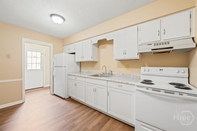 310 Ashmore St Unit A, B, Hinesville, GA 31313 - kitchen with white appliances, under cabinet range hood, a sink, light wood-style flooring, and light countertops