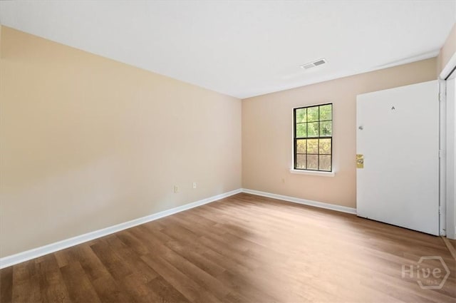 310 Ashmore St Unit A, B, Hinesville, GA 31313 - empty room with wood finished floors and baseboards