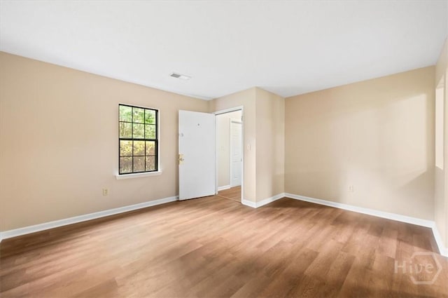 310 Ashmore St Unit A, B, Hinesville, GA 31313 - unfurnished bedroom featuring wood finished floors, baseboards, and a closet