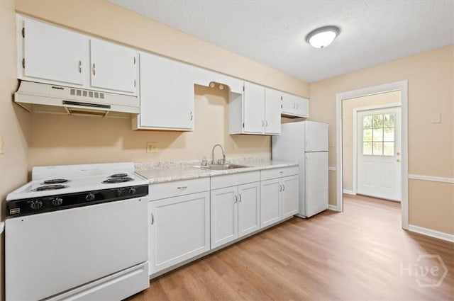 310 Ashmore St Unit A, B, Hinesville, GA 31313 - kitchen with white appliances, under cabinet range hood, a sink, light wood-style flooring, and light countertops