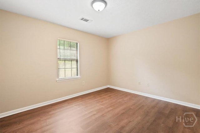 310 Ashmore St Unit A, B, Hinesville, GA 31313 - spare room with wood finished floors and baseboards