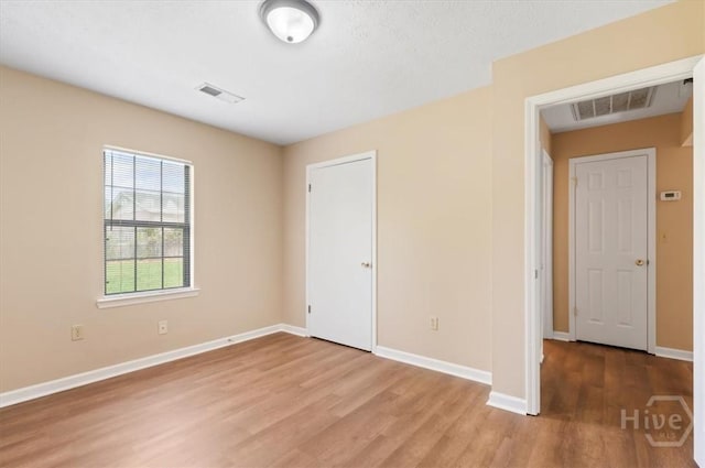 310 Ashmore St Unit A, B, Hinesville, GA 31313 - unfurnished bedroom with light wood finished floors and baseboards