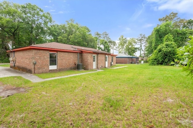 310 Ashmore St Unit A, B, Hinesville, GA 31313 - view of grassy yard featuring cooling unit