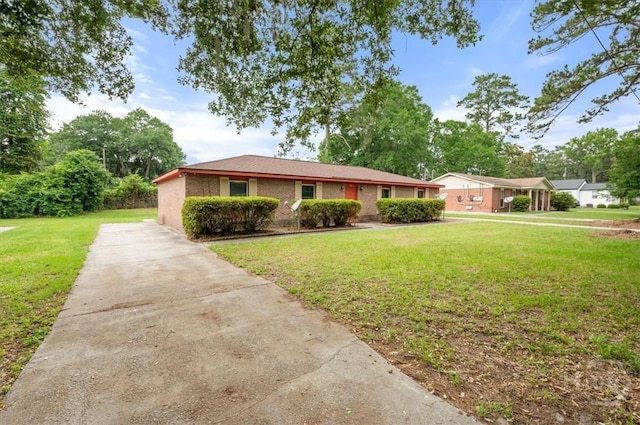 310 Ashmore St Unit A, B, Hinesville, GA 31313 - ranch-style house featuring a front lawn, concrete driveway, and brick siding