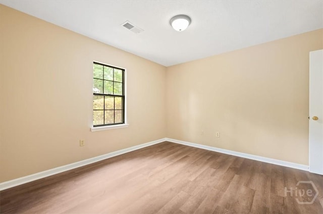 310 Ashmore St Unit A, B, Hinesville, GA 31313 - spare room featuring wood finished floors and baseboards