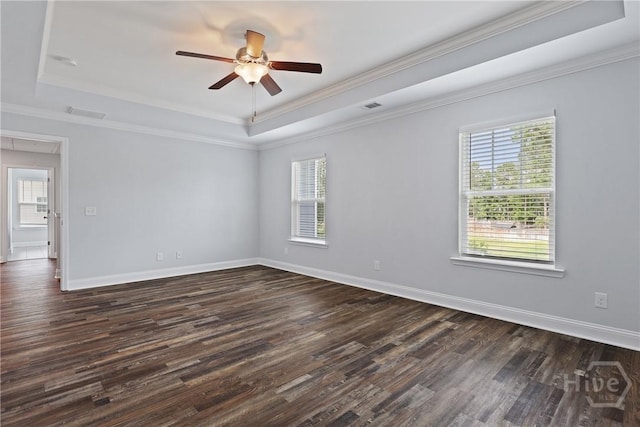 194 Shortleaf Trl, Richmond Hill, GA 31324 - unfurnished room with a raised ceiling, healthy amount of natural light, dark wood-type flooring, ceiling fan, and ornamental molding