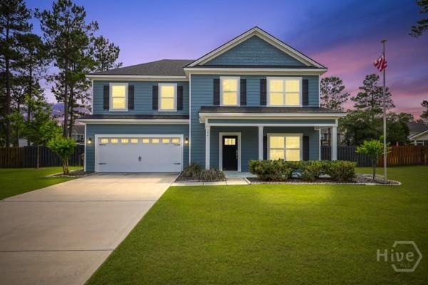 194 Shortleaf Trl, Richmond Hill, GA 31324 - view of front of house with a garage, concrete driveway, and a porch