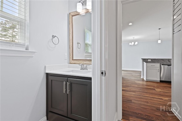 194 Shortleaf Trl, Richmond Hill, GA 31324 - bathroom with plenty of natural light, wood finished floors, vanity, and baseboards