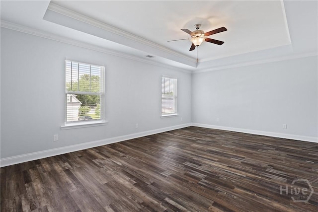 194 Shortleaf Trl, Richmond Hill, GA 31324 - spare room featuring a tray ceiling, plenty of natural light, dark wood-style flooring, ornamental molding, and a ceiling fan