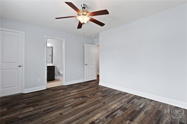 194 Shortleaf Trl, Richmond Hill, GA 31324 - unfurnished bedroom with wood finished floors, baseboards, connected bathroom, and a ceiling fan