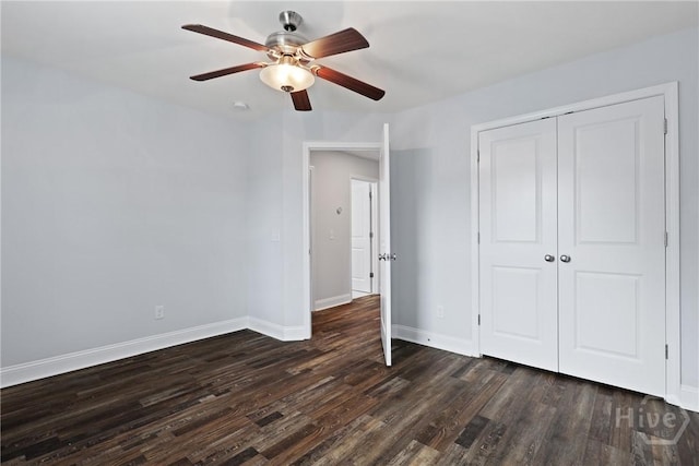 194 Shortleaf Trl, Richmond Hill, GA 31324 - unfurnished bedroom with dark wood finished floors, baseboards, a closet, and ceiling fan