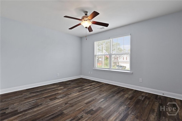 194 Shortleaf Trl, Richmond Hill, GA 31324 - spare room featuring dark wood finished floors, baseboards, and ceiling fan