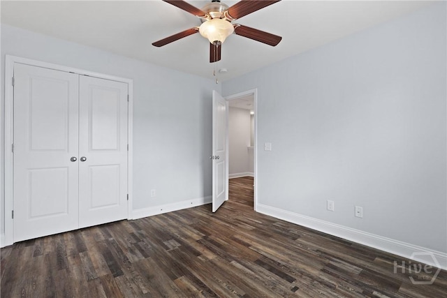 194 Shortleaf Trl, Richmond Hill, GA 31324 - unfurnished bedroom featuring dark wood finished floors, baseboards, a closet, and a ceiling fan