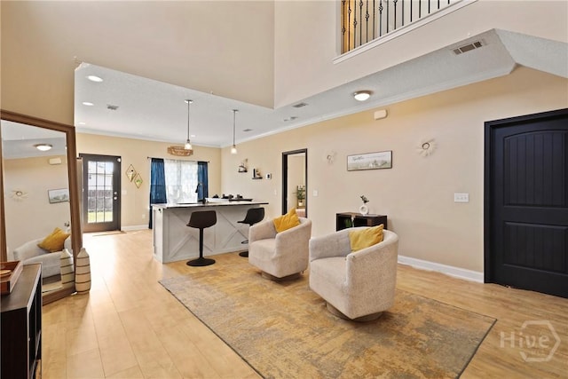 806 Fairview Cir, Hinesville, GA 31313 - living room with light wood-style flooring, ornamental molding, and baseboards